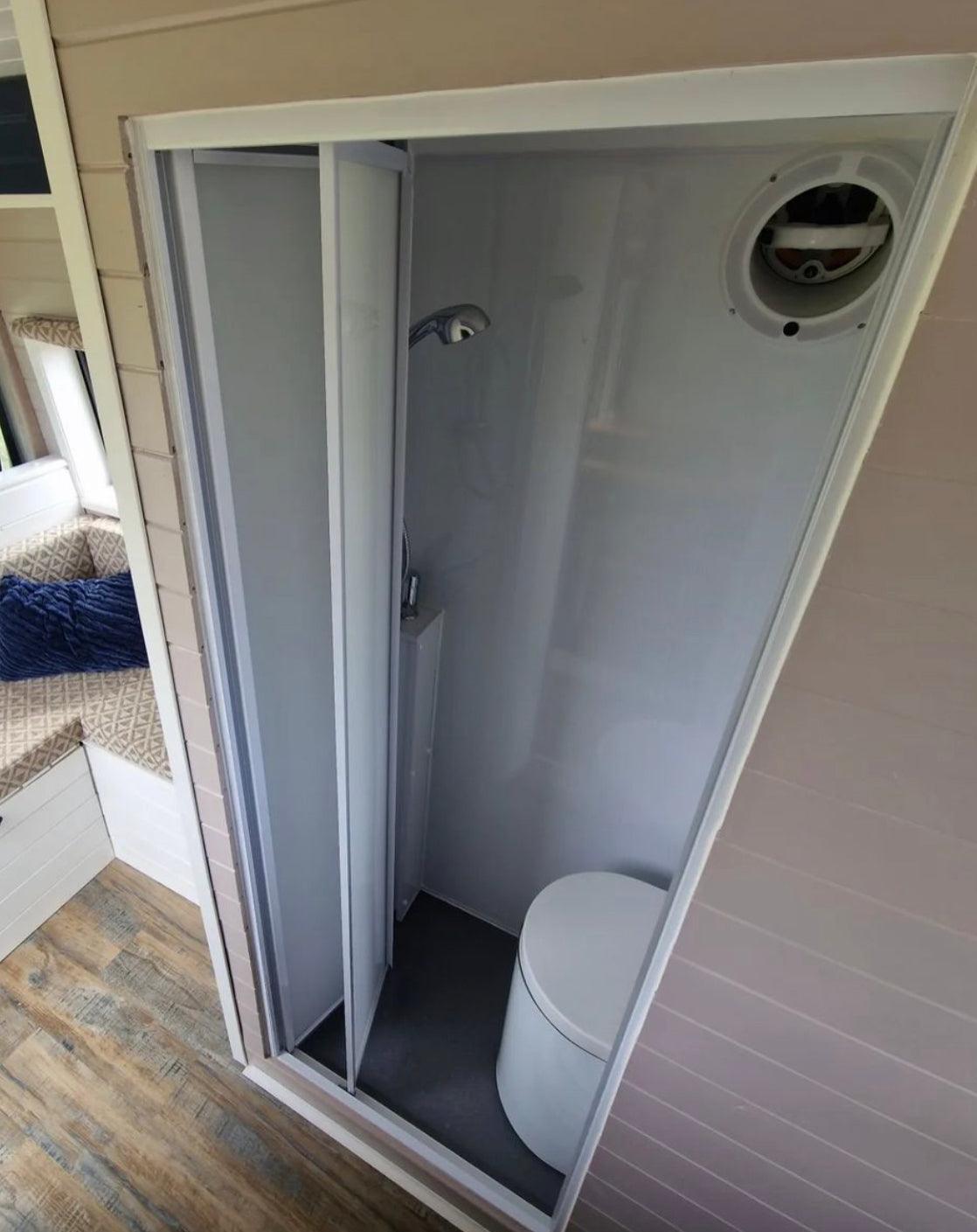 White FOLdoûr Bi Fold Accordion Aluminium Frame Frosted White Acrylic Shower Screen Door Designed for a Campervan