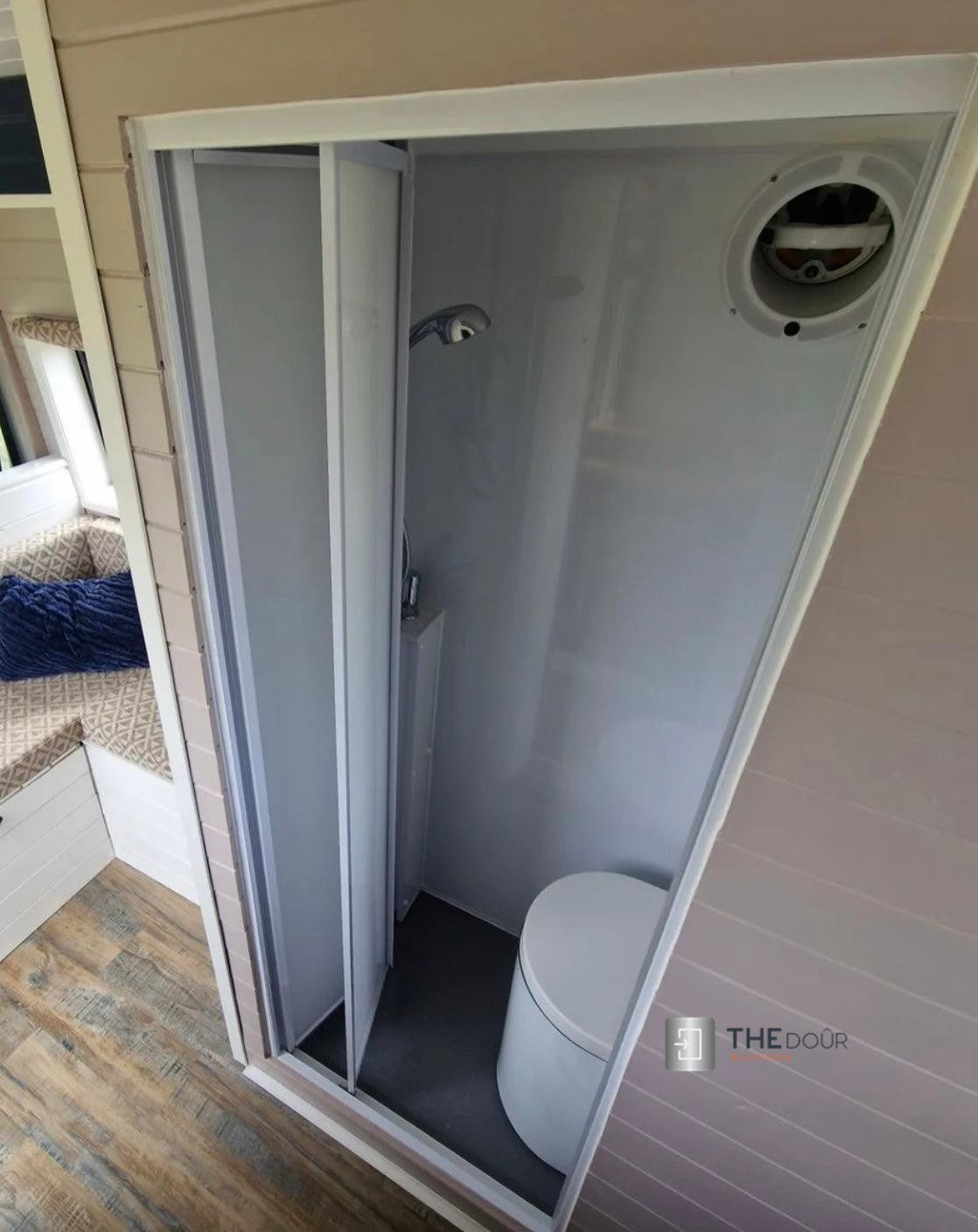 White FOLdoûr Bi Fold Accordion Aluminium Frame Frosted White Acrylic Shower Screen Door Designed for a Campervan